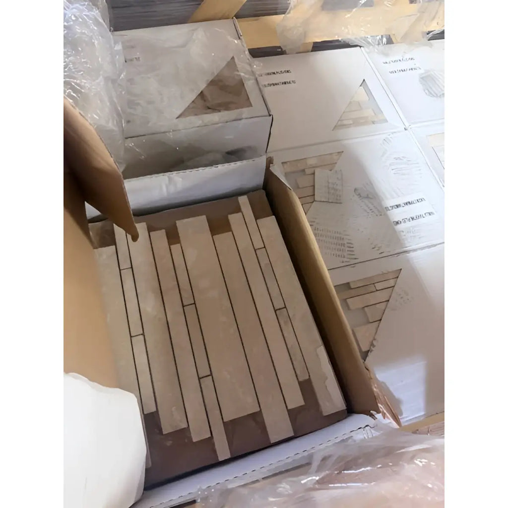 Ivory Travertine Random Strip Mosaic in beige brown tiles in open box