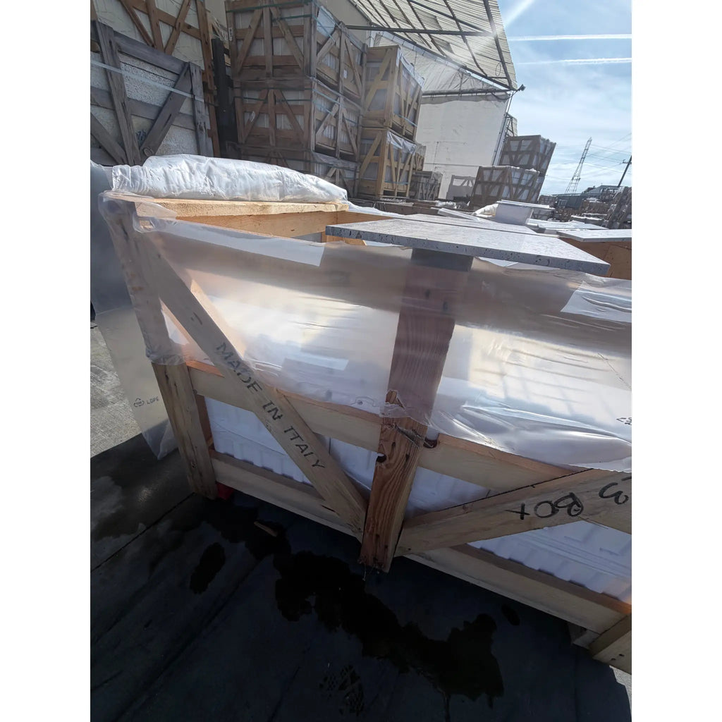 Wooden crate with plastic wrap and padding for Legno DArgento Striato Roman Silver Travertine tile, Made in Italy