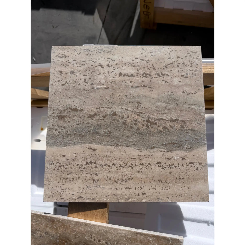 Legno D’Argento Striato Roman Silver Travertine 12x12 vein-cut tile with beige and gray stone veining