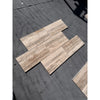 Legno D’Argento Striato Roman Silver Travertine 12x24 vein-cut tile in staggered beige tan pattern
