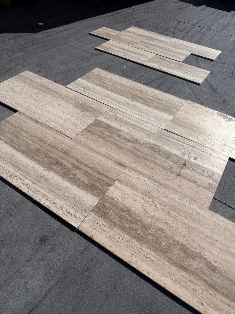 Beige and tan Roman Silver Travertine 12x24 vein-cut floor tiles with textured surface