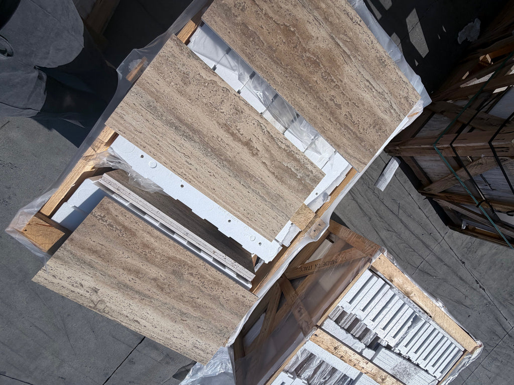 Beige Legno D’Argento Striato marble-effect countertop panels, stacked on pallets