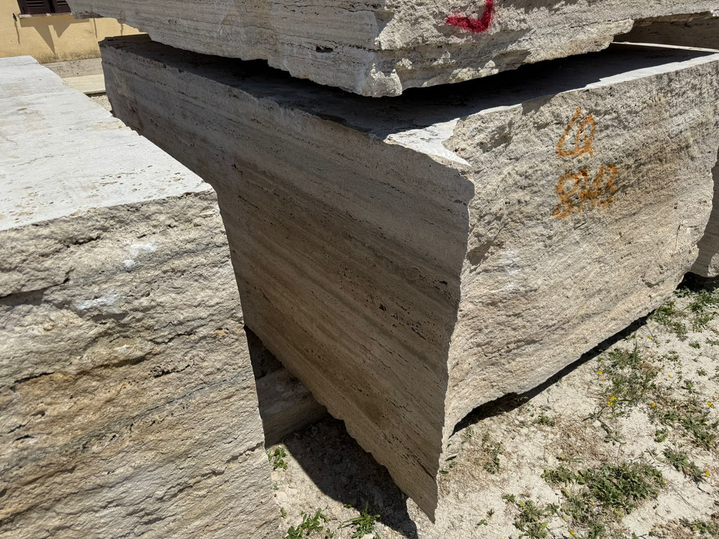 Legno D’argento Striato Roman Silver Travertine 18x36 vein-cut tile with stacked light beige slabs and natural striations