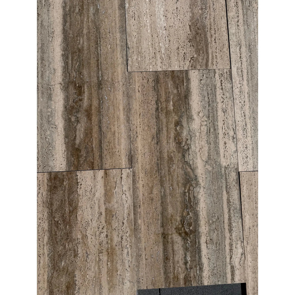 Gray and brown Legno D’argento Striato Roman Silver Travertine 18x36 vein-cut tiles with natural textured stone-look finish
