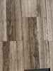 Gray and brown Legno D’argento Striato Roman Silver Travertine 18x36 vein-cut tiles with natural textured stone-look finish