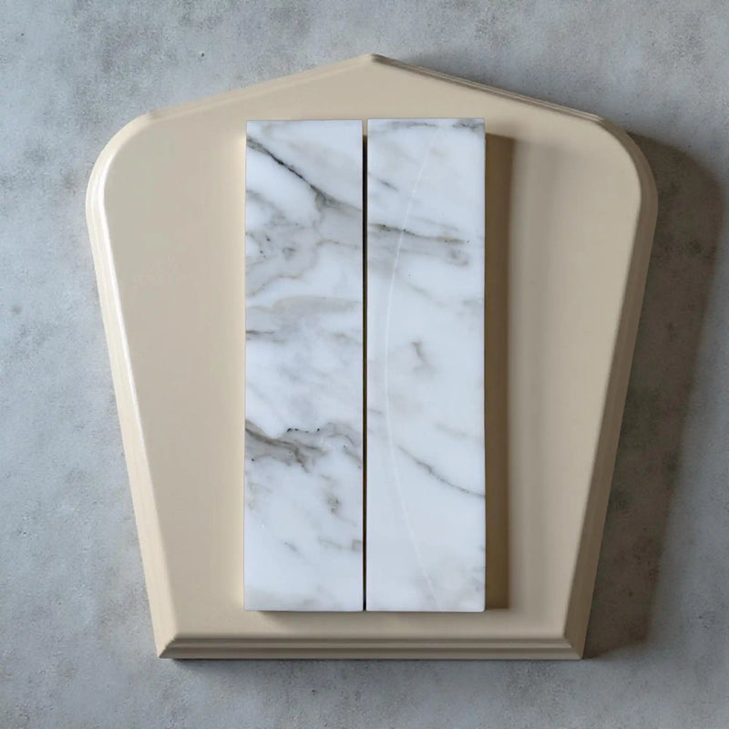 Marble-patterned tiles on a beige frame.