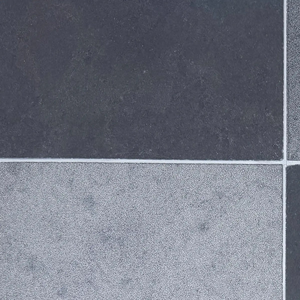 Milano Heritage 16x24 reclaimed limestone tile in dark and light gray textured speckles