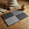 Four rectangular slate tiles in dark and medium gray shades arranged on wood milano heritage 16x24 multi finish reclaimed limestone tile