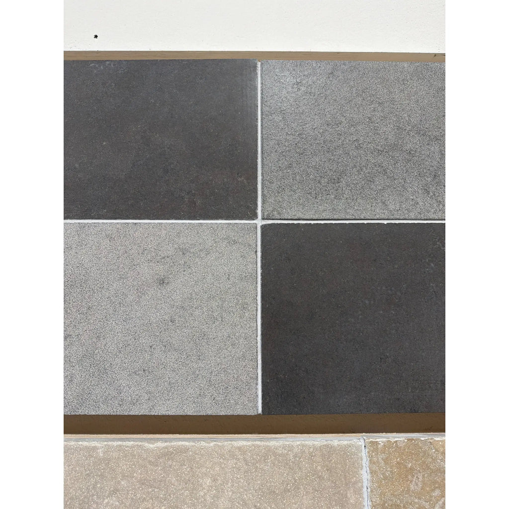 Milano Heritage reclaimed limestone tile in dark and light gray textured grid