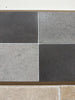 Milano Heritage reclaimed limestone tile in dark and light gray textured grid