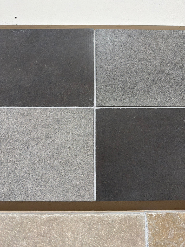 Milano Heritage reclaimed limestone tile in dark and light gray textured grid