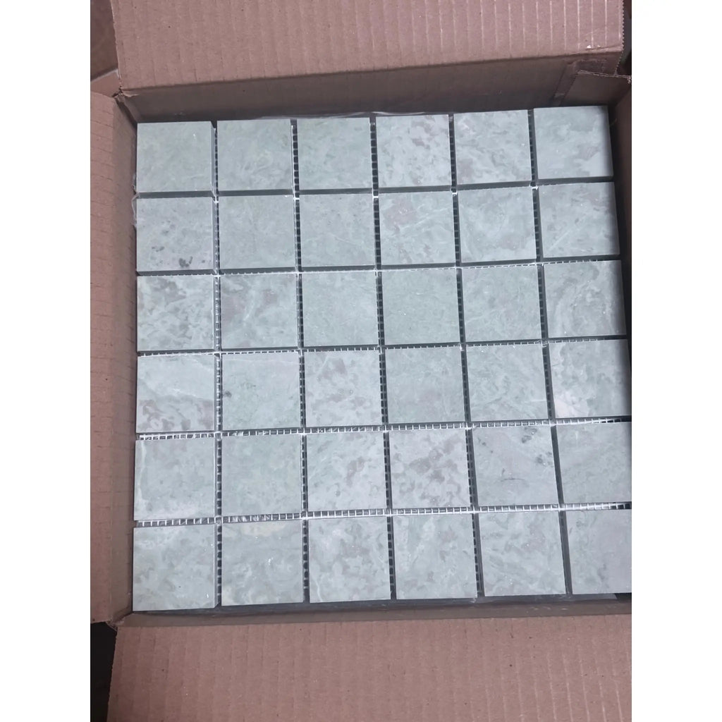 Gray marble mosaic tiles in open box, like Ming Green 2x2 polished-honed
