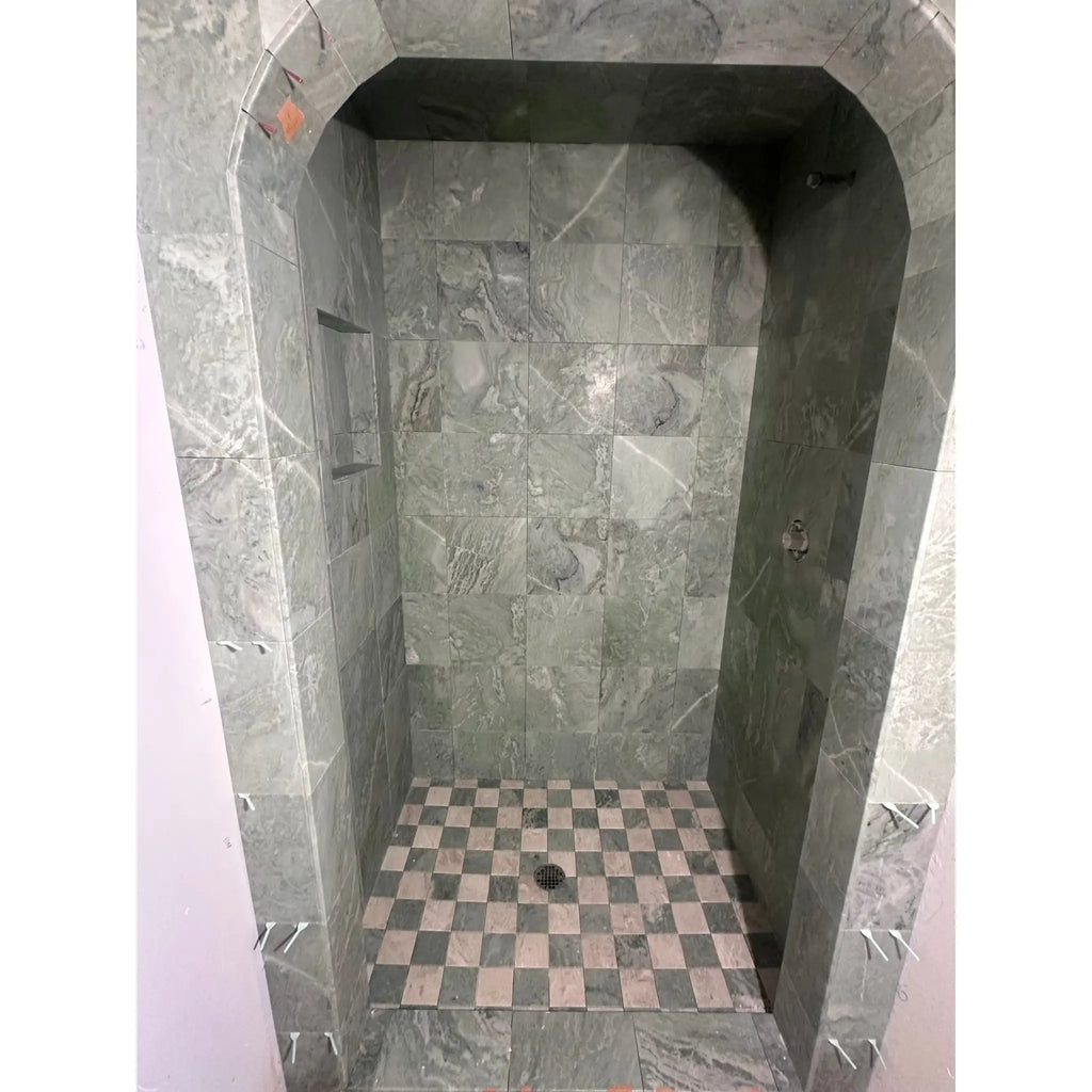 Gray marble shower stall with polished-honed ming green 2x2 mosaic marble tile and checkered pink gray floor tiles