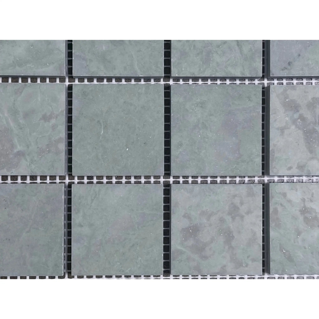 Gray stone mosaic tiles in Ming Green 2x2 polished-honed grid
