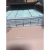 Stack of Ming Green 2x2 mosaic marble tiles in clear plastic wrap