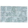 Grid of 15 pale green-grey Ming Green 3x3 tumbled stone tiles with subtle variegation