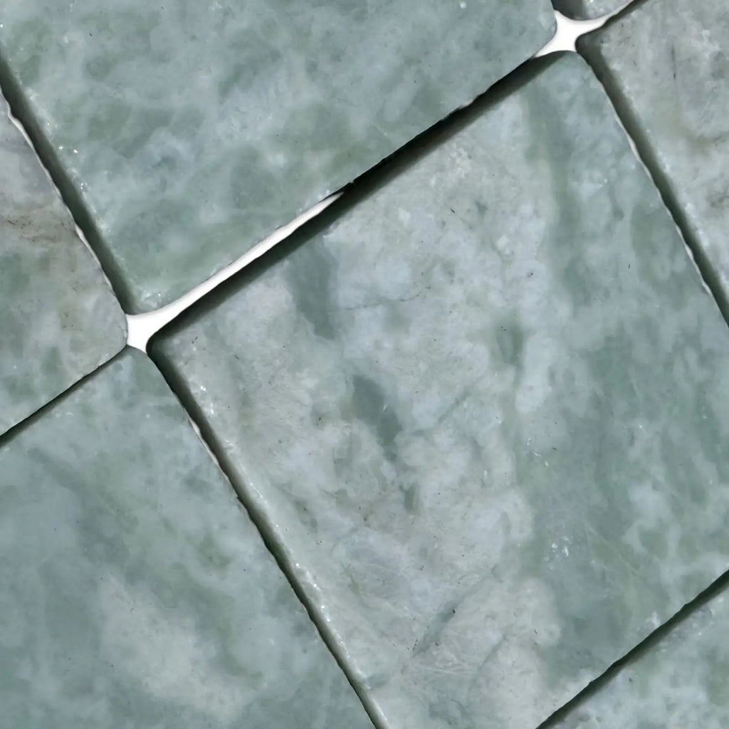 Light green marble tiles with white grout in Ming Green 3X3 Tumbled product display