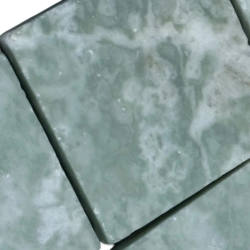 Ming Green 3x3 Tumbled tiles featuring green onyx with natural white veining