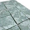 Square-cut Ming Green 3x3 tumbled marble tiles with natural veining for elegant flooring