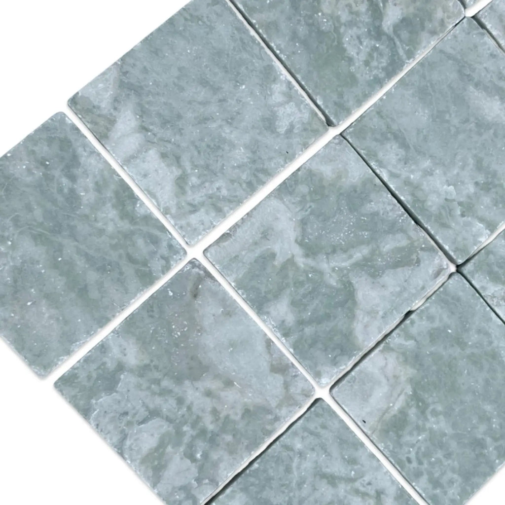 Square pale green textured floor tiles from Ming Green 3X3 Tumbled collection