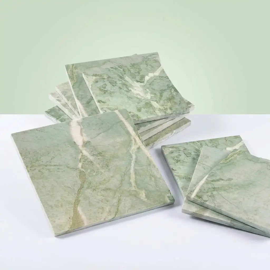 Square green marble tiles with swirling white and beige veining in ming green jade green 12x12 polished or honed finish