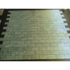 Green marble-effect rectangular tiles arranged in a staggered brick pattern for ming green jade green 12x24 polished or honed finish
