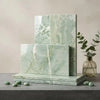 Stacked rectangular ming green jade green 12x24 marble polished tiles with light green marble pattern and subtle veining