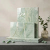 Stacked rectangular ming green jade green 12x24 marble tiles with light green polished or honed veined pattern