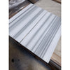 Four white marble tiles with gray linear veining from Mink Marmara Equator Zebra Marble 12X12