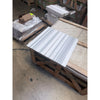 White marble tiles with prominent gray veining from Mink Marmara Equator Zebra Marble 12X12 Polished