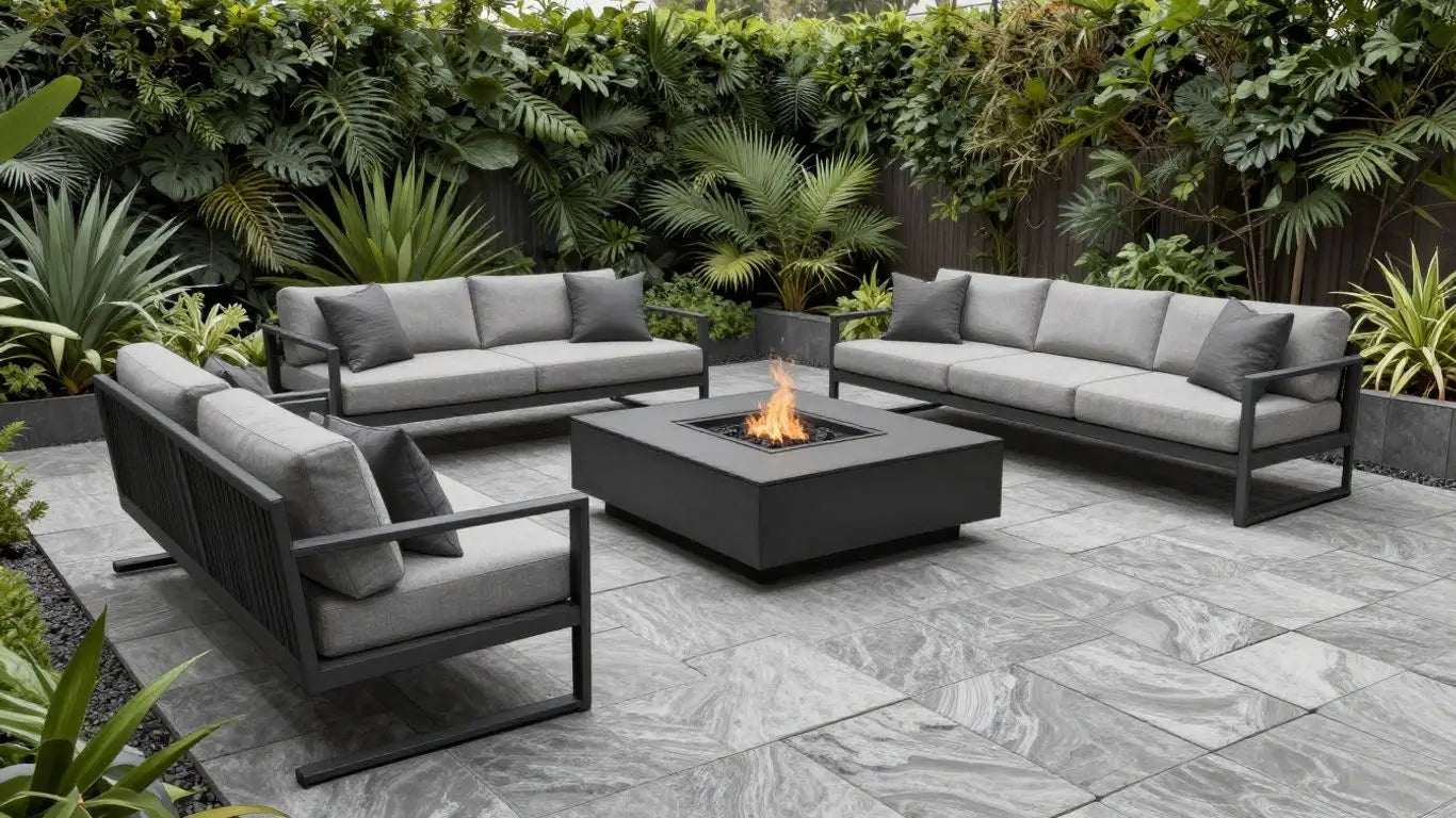 Gray limestone patio with fire pit and seating.