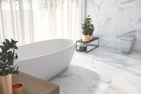 Modern white bathtub enhancing the beauty of natural stone in home design.