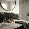 Black hexagonal neromarquina marble mosaic polished tiles forming a modern backsplash behind the sink