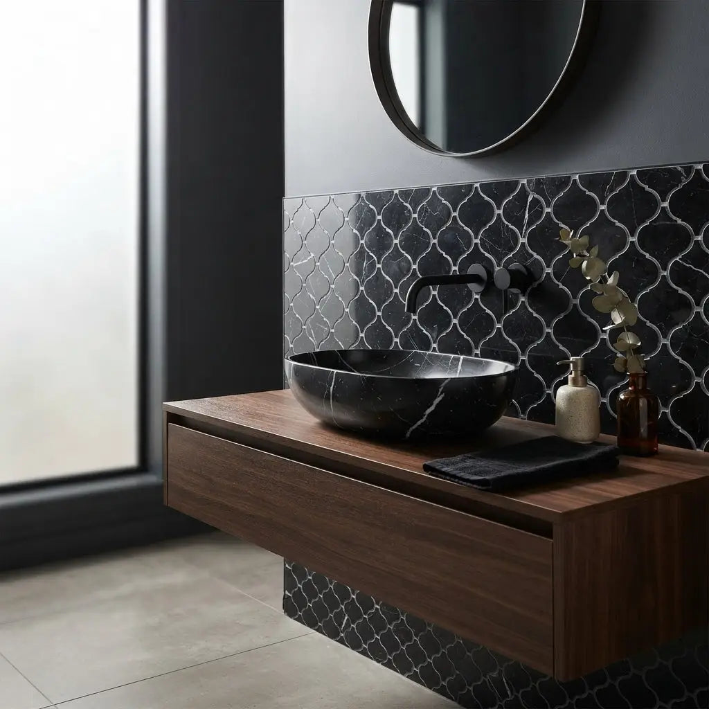 Black marble bowl sink with sleek modern design made of Nero Marquina polished marble mosaic tiles