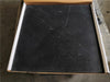Black Nero Marquina marble coaster set with white veining in a cardboard box