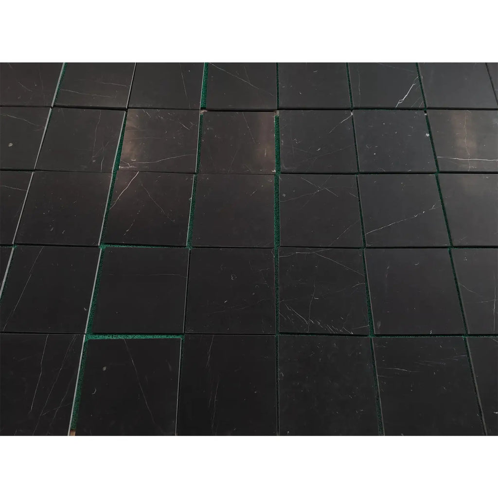 Black marble tile coaster set with green accents and white veining for Nero Marquina 12x12