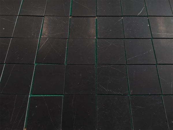 Black marble tile coaster set with green accents and white veining for Nero Marquina 12x12