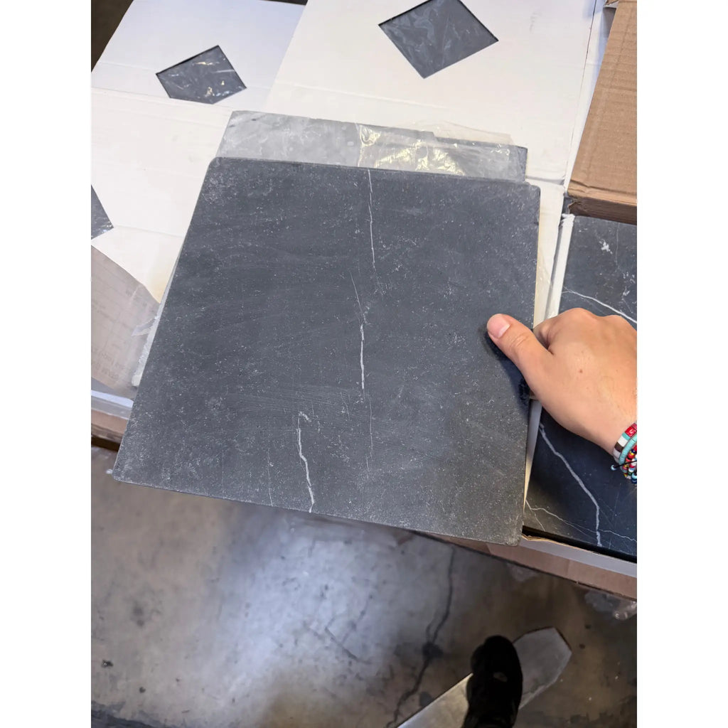 Nero Marquina black marble 12x12 tumbled tile with subtle veining