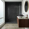 Black hexagonal Nero Marquina marble mosaic polished tiles covering the shower enclosure interior wall