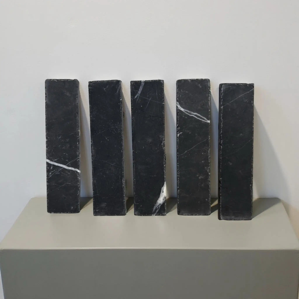 Five black marble rectangles in Nero Marquina Marble 2X8 Mosaic tile design