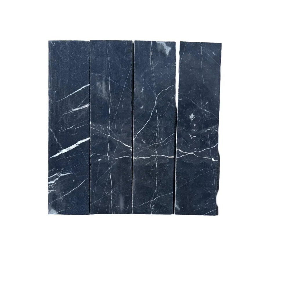 Black marble tile strips with white veining in Nero Marquina Marble 3’’ X 12’’ Field Tile