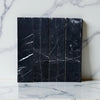 Black marble tiles with white veining in Nero Marquina Marble 3’’ X 12’’ Field Tile