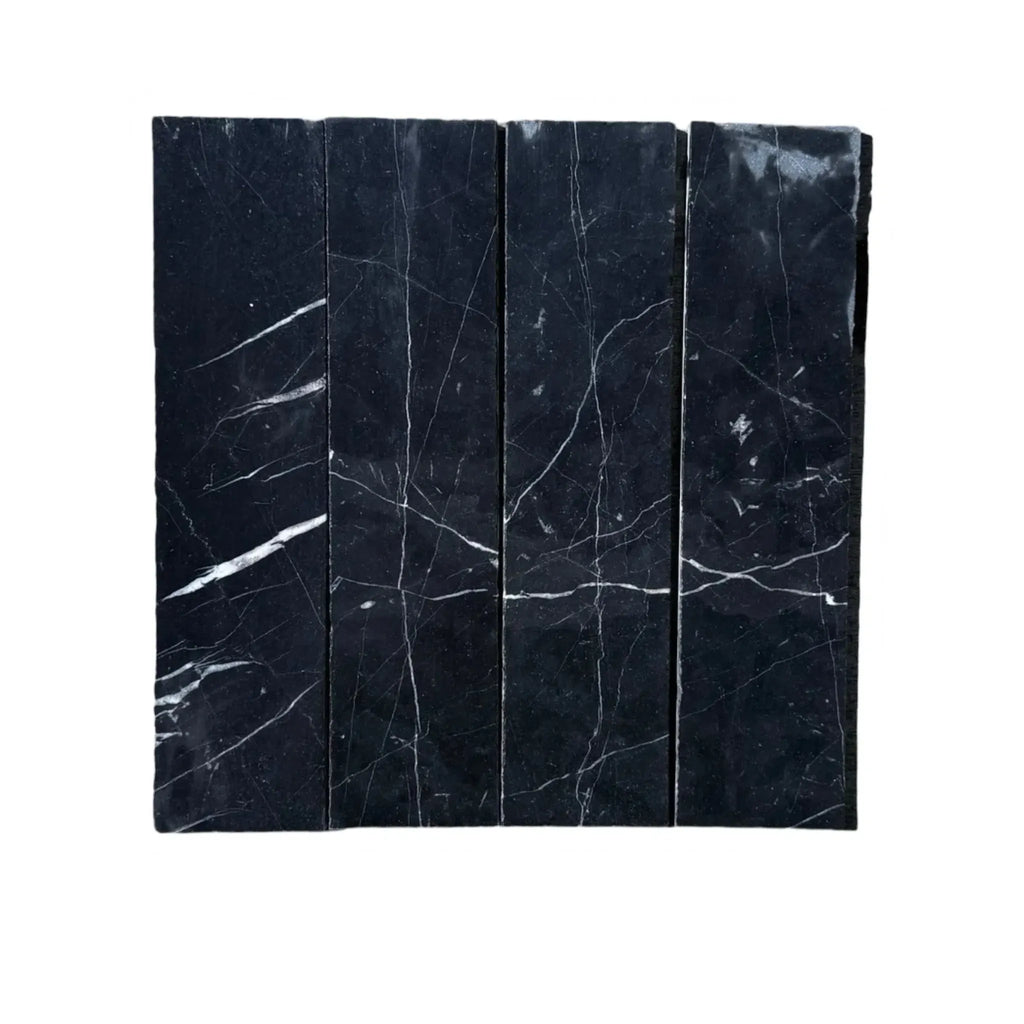 Black marble tiles with white veining in Nero Marquina Marble 3 X 12 Field Tile