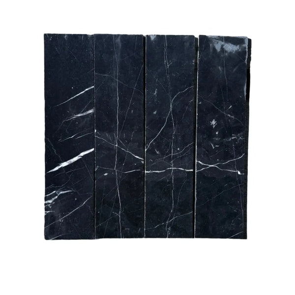 Black marble tiles with white veining in Nero Marquina Marble 3 X 12 Field Tile