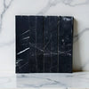 Black marble tiles with white veining in Nero Marquina Marble 3’’ X 12’’ Field Tile