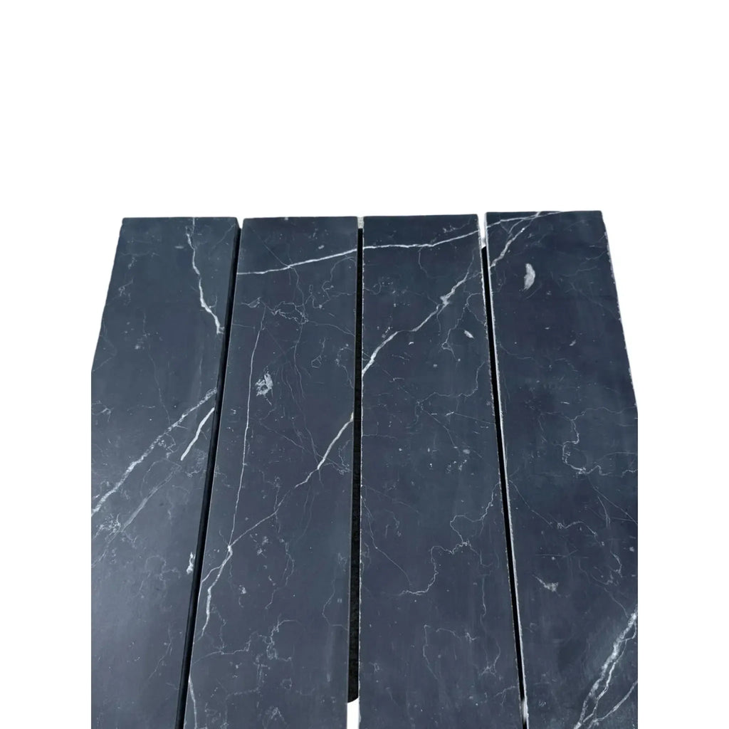 Black marble tiles with white veining in Nero Marquina Marble 3’’ X 12’’ Field Tile