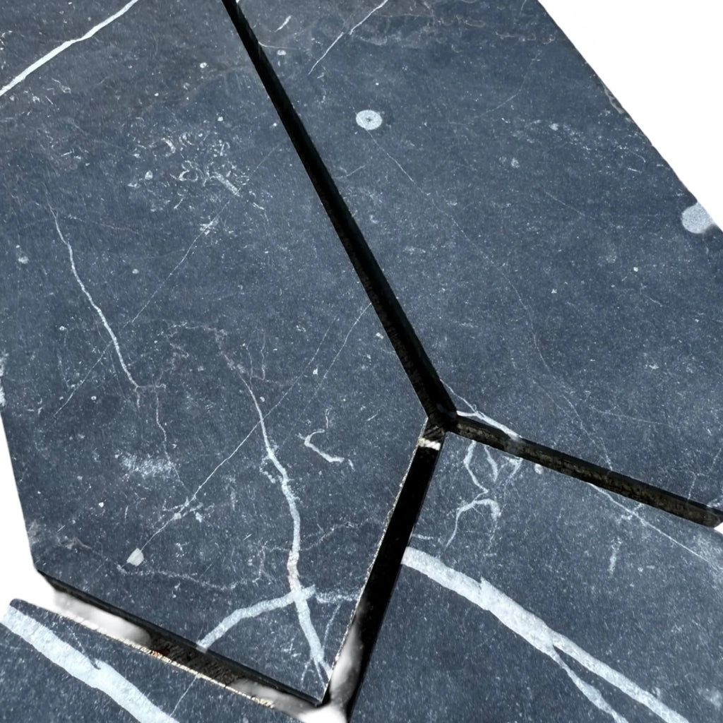 Dark marble tiles with white veining in Nero Marquina Marble 3’’ X 12’’ Picket Mosaic