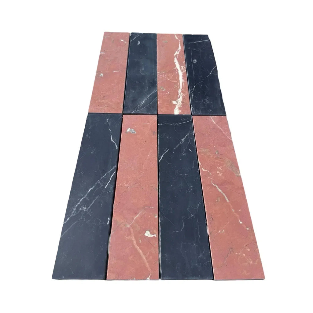 Alternating black and red marble tiles in Nero Marquina Rojo Alicante field tile design