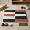Set of nero marquina black, rojo alicante terracotta, and carrara white rectangular marble tiles with natural veining in striped pattern
