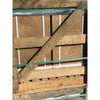 Weathered wooden pallet with diagonal support beam and green straps securing noce brown travertine 12x24 cross-cut tiles